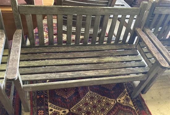 A slatted wood garden bench and two matching chairs, bench 124cm
